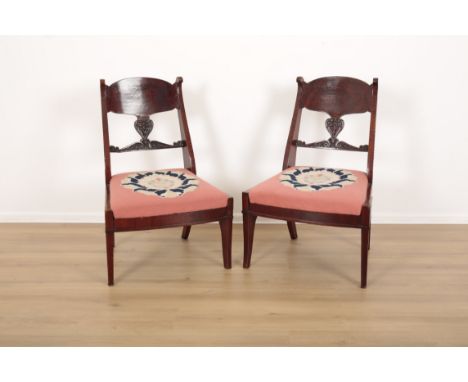 A PAIR OF RUSSIAN FLAME MAHOGANY CHAIRSlate 18th century or later, carved with flowers and acanthus leaves on the splats and 