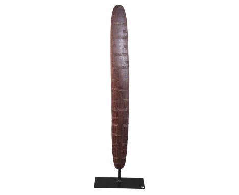 AN ABORIGINAL SHIELDSouth East Australia, early 20th century, decorated with incised linear banding, 75cm high x 8.5cm wide, 