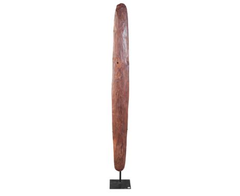 AN ABORIGINAL SHIELDAustralia, probably 19th century, with a stone tool carved scalloped face, 87cm high x 9cm wide, with ass