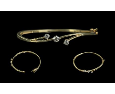 14ct Yellow Gold - Attractive and Contemporary 3 Stone Diamond Set Hinged Bangle. Marked 14ct to Bangle, The 3 Round Brillian