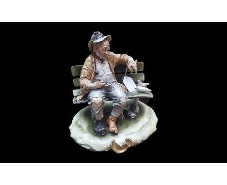 Capodimonte 'Tramp on Bench' signed B Marli, depicts a tramp on a bench feeding to doves.  Measures approx. 9" high x 9" wide