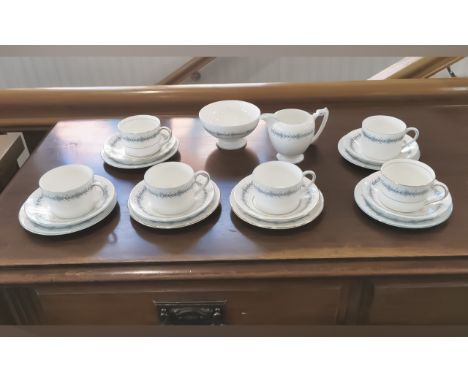 Coalport Tea Service, comprising six cups, saucers and side plates, a milk jug and sugar bowl.  White ground with blue patter