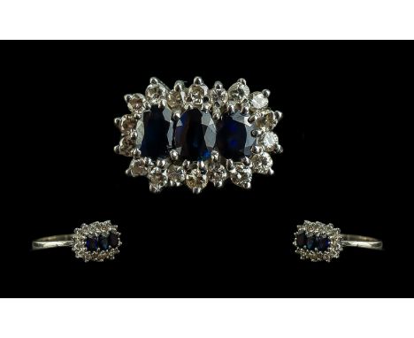 18ct White Gold - Attractive Sapphire and Diamond Set Ring. Marked 18ct to Shank. The Trio of Blue Sapphires, Surrounded by 1
