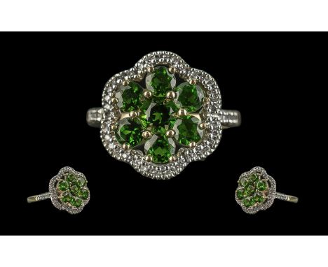 Ladies Green Tourmaline and Diamond Ring in 9ct gold, the green tourmalines surrounded by the diamonds, which continue down t