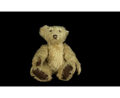 Light Golden Brown Teddy Bear, possibly 1950s Steiff, with a distinctive head shape and brown glass eyes, the body with joint