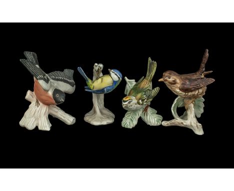 Four Goebel Bird Figures, comprising Blue Titmouse 4'' tall,  Firecrest 4'' tall, a small spotted bird 4'' tall, and a Tit 4'