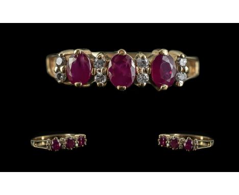 Ladies 9ct Gold Attractive Ruby &amp; Diamond Set Ring, marked 9.375 to shank.  Rubies of good colour, deep red.  The diamond