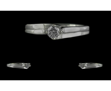 18ct White Gold Contemporary Single Stone Diamond Set Ring, marked 18ct to shank.  The brilliant cut round diamond of excelle