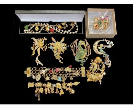 Collection of Costume Jewellery - including fantasy brooches depicting fairies and dragons, jewel encrusted, a charm bracelet