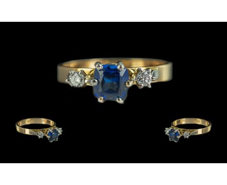 Ladies 18ct Gold Attractive 3 Stone Sapphire and Diamond Set Ring. Marked 18ct to Shank. The Blue Square Faceted Sapphire of 