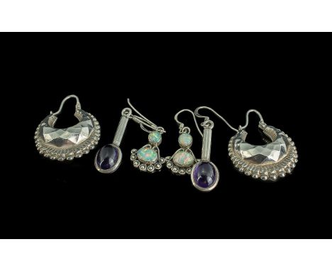 Three Pairs of Sterling Silver Earrings, comprising a pair of Thai style hoops, 1" across, a pair of silver drop earrings set