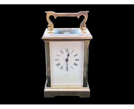 Brass Carriage Clock by A Fattorini, Harrogate.  With key, working at time of cataloguing.  Measures 6" tall x 3" wide.