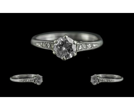 Ladies Platinum Diamond Set Dress Ring. Marked Platinum to Interior of Shank. The Central Round Brilliant Cut Diamond of Good