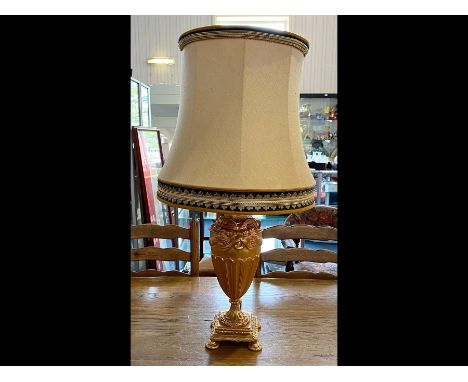 Large Gilt Table Lamp, with ornate rams head decoration.  Raised on four feet.  Measures approx. 18" high, fitted with qualit