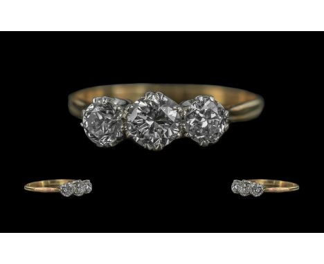 Ladies 18ct Yellow Gold and Platinum 3 Stone Diamond Set Ring. Marked 18ct and Platinum. The 3 Round Old Brilliant Cut Diamon
