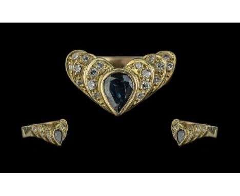 18ct Sapphire &amp; Diamond Ring, pear shaped sapphire set between round brilliant cut diamonds, stamped 18ct.  Ring size M.