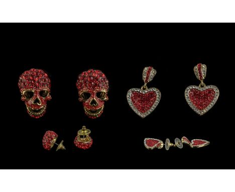 Butler &amp; Wilson, two pairs of earrings for pierced ears, comprising a pair of red diamante skull earrings, and a pair or 
