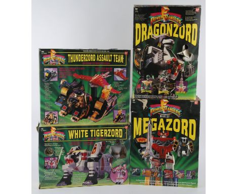 Power Rangers Action Figure CollectionCollection of 4 Power Rangers action figures, produced by Bandai, to include; Thunderzo