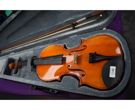 A Stagg violin in plush case, width bow