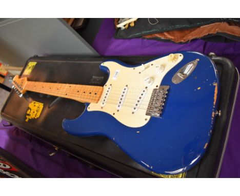 A Squier by Fender, Stratocaster, Korean made serial number 914533, in Fender Hardcase, case af with damage to hinge, distres