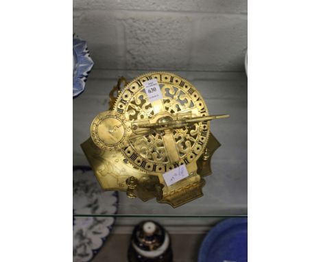 A reproduction brass equatorial sundial.