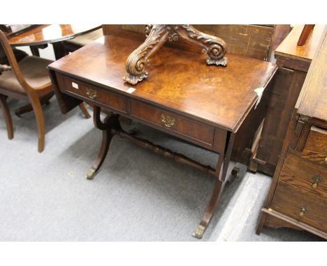 A reproduction burr wood sofa table.