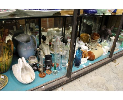 A large shelf of decorative china, glass etc.