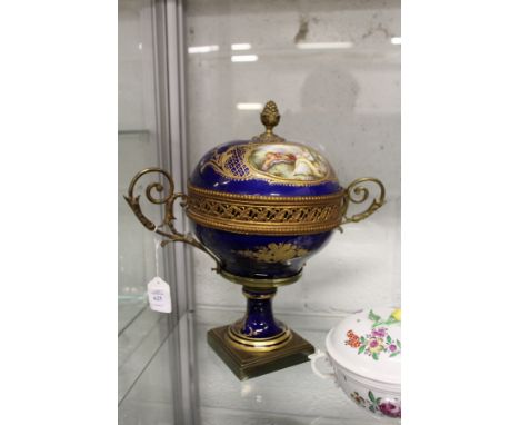 A continental porcelain and ormolu bowl and cover.