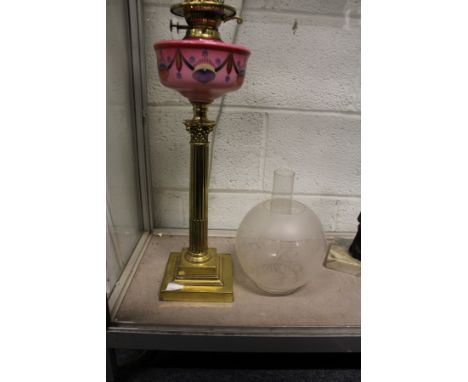 A good brass Corinthian column oil lamp with painted porcelain reservoir.