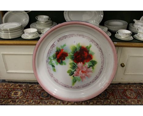 A large continental circular enamel dish.
