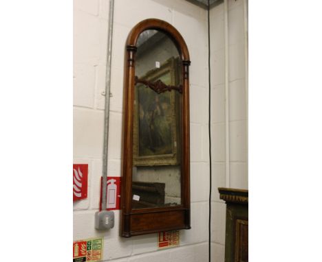 A Victorian mahogany arch topped mirror.