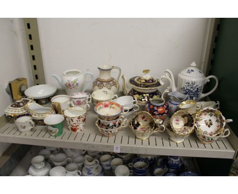 A shelf of decorative tea ware etc.