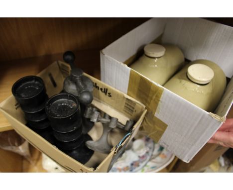 A small group of Robert Welch ironware to include candlesticks and a nut cracker, together with two stone hot water bottles.