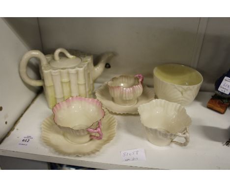 A Belleek porcelain faux bamboo teapot and other Belleek porcelain.