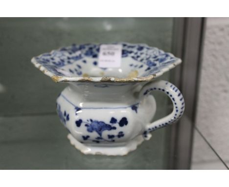 A 19th century blue and white decorated porcelain personal spitoon.