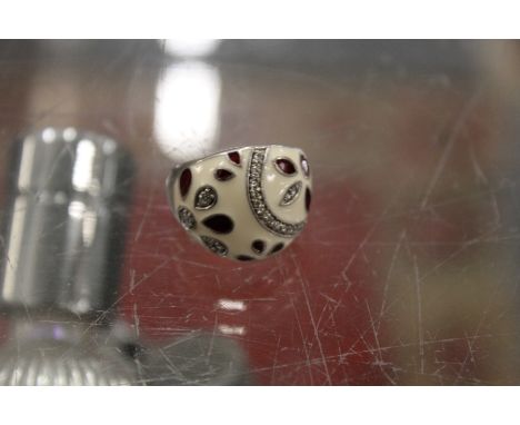 A silver and enamel ring.