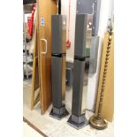A pair of Bang & Olufsen tall column shaped speakers.