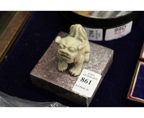 A Chinese carved soapstone lion dog seal.