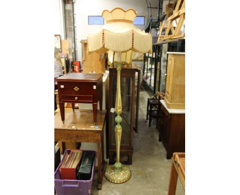 A decoratively painted floor standing lamp with ornate shade and another shade.