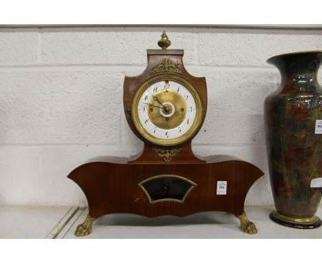 A decorative French mantle clock.
