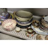 A shelf of decorative china.