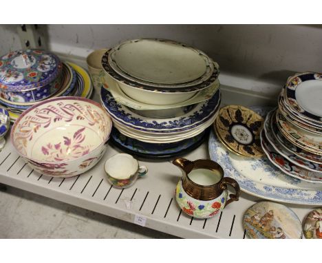 A shelf of decorative china.