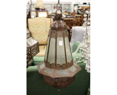 A decorative eastern style patinated metal hanging lantern.