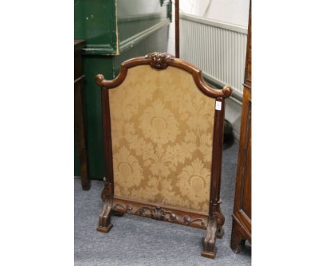 A Victorian mahogany fire screen.