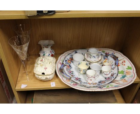 Decorative china and a pair of cut glass champagne flutes.