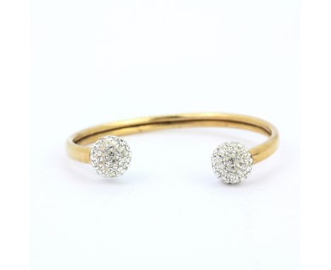 A 9ct yellow gold stone set torque bangle, L. 5.5cm. Approx. 7.3gr.