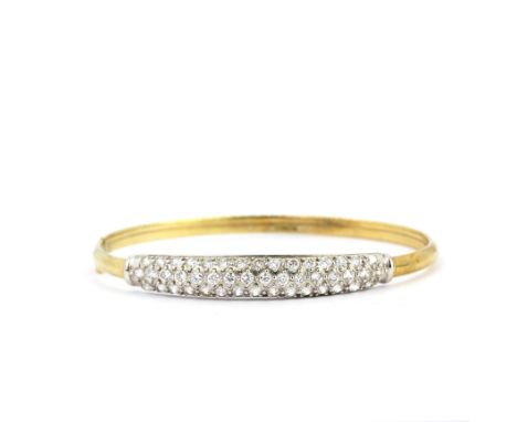 A 9ct yellow gold stone set bangle, L. 5.8cm. Approx. 6.6gr.