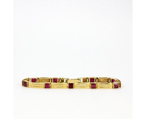 An 18ct yellow gold (stamped 750) ruby set braclet, L. 17cm. Approx. 8.2gr.