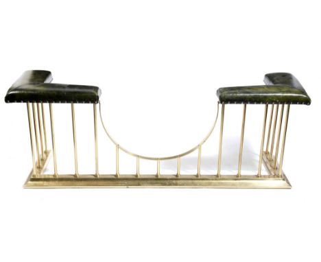 A modern brass club fender, with studded green leatherette seats, 64cm high, 172cm wide, 46cm deep.