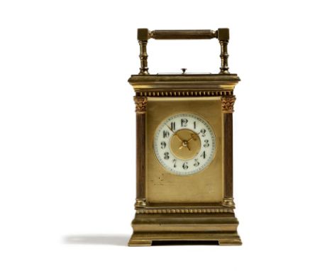 A French gilt brass repeating carriage clock, the eight day movement striking on a gong, the backplate stamped '4243', the ci